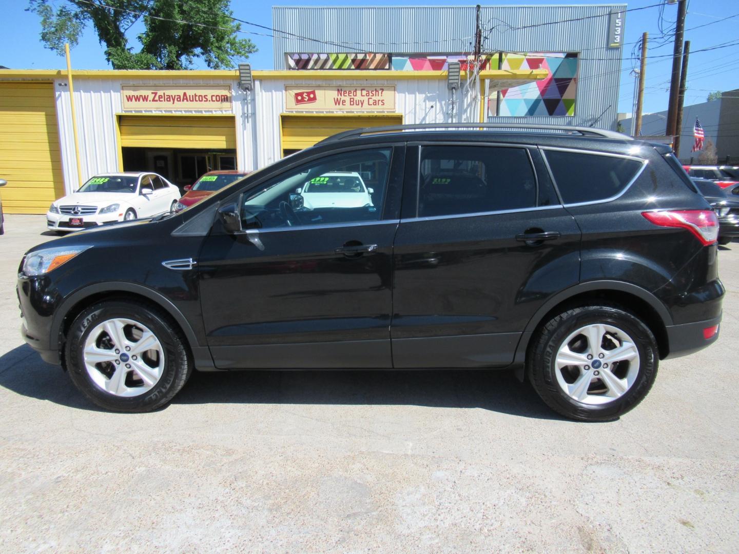 2014 Black /Black Ford Escape SE 4WD (1FMCU9GX5EU) with an 1.6L L4 DOHC 16V engine, Automatic transmission, located at 1511 North Shepherd Dr., Houston, TX, 77008, (281) 657-1221, 29.798361, -95.412560 - 2014 FORD ESCAPE SE VIN: 1FMCU9GX5EUC37295 1 F M C U 9 G X 5 E U C 3 7 2 9 5 4 DOOR WAGON/SPORT UTILITY 1.6L I4 F DOHC 16V GASOLINE FRONT WHEEL DRIVE W/ 4X4 - Photo#0